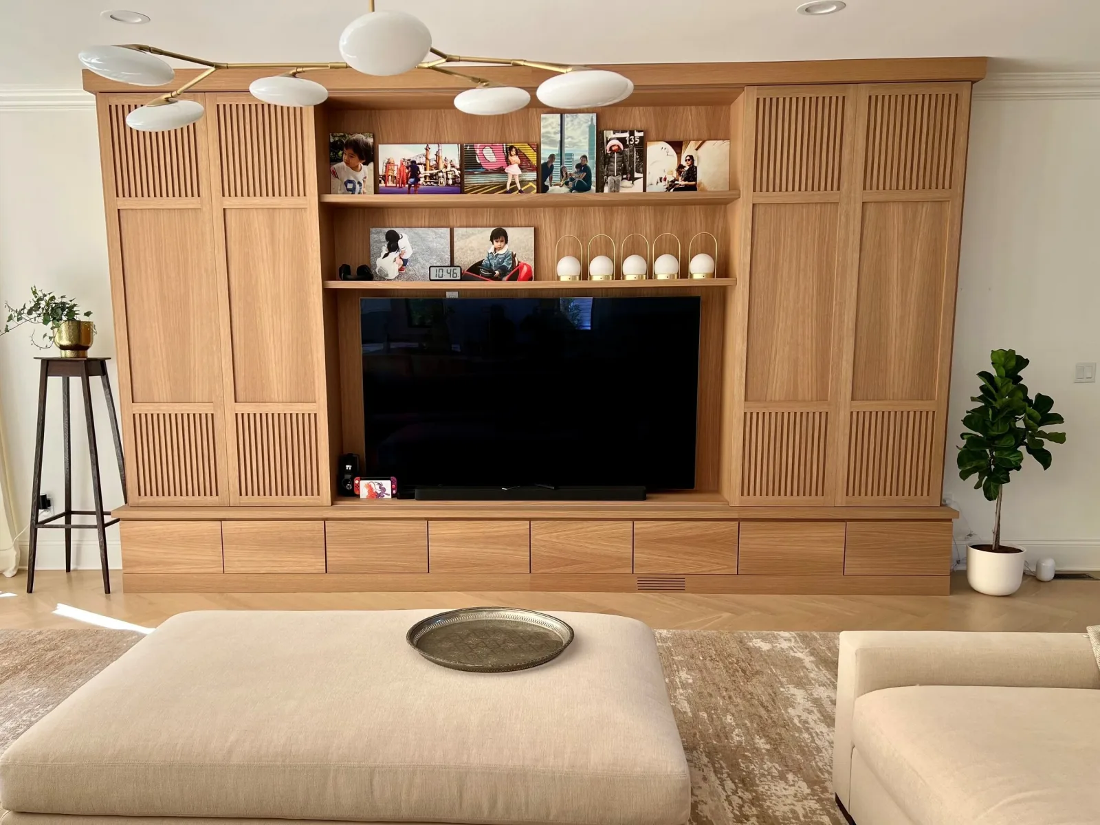 Custom white-oak built-in wall, designed and built by Heard Woodworking