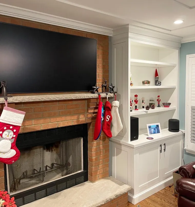 Custom fireplace surround cabinetry by Heard Woodworking — project 2