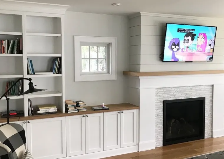 Custom fireplace surround cabinetry by Heard Woodworking — project 3