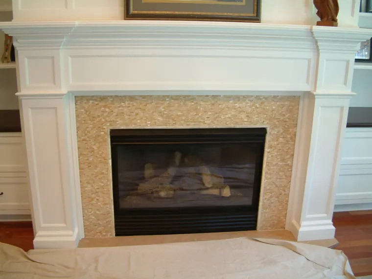Custom fireplace surround cabinetry by Heard Woodworking — project 9