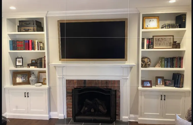 Custom fireplace surround cabinetry by Heard Woodworking — project 11